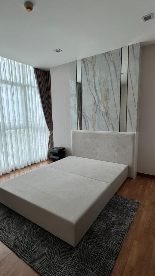 Modern bedroom with floor-to-ceiling windows