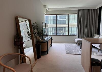 Modern living room with large window and minimalist decor