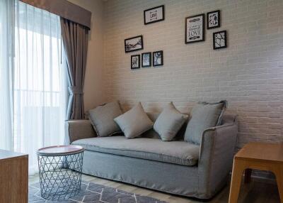 Cozy living room with a grey sofa and decor