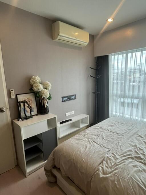 Bedroom with air conditioner and decor