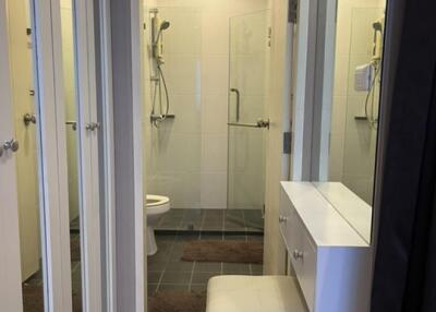 Modern bathroom with shower and mirror cabinets