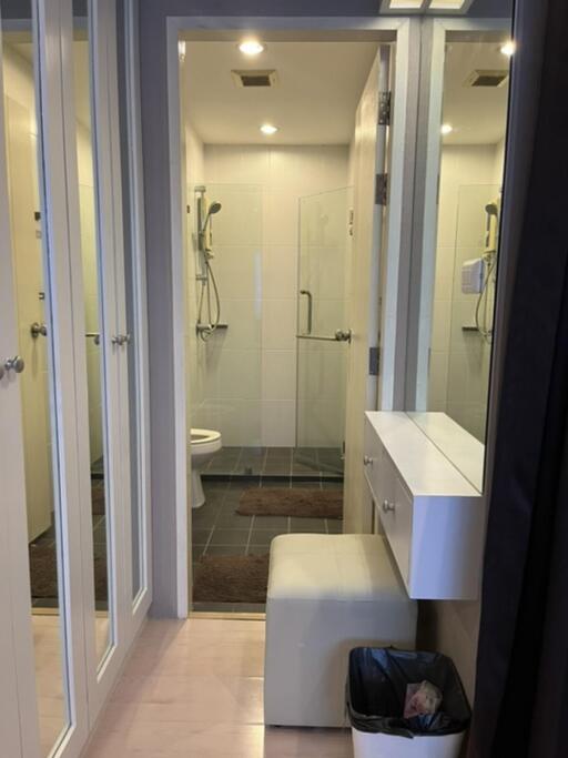 Modern bathroom with shower and mirror cabinets