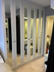 Bedroom with mirrored wardrobe doors