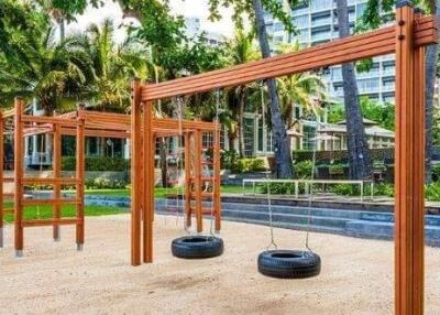 Outdoor playground area with tire swings