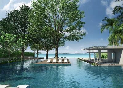 Scenic outdoor pool area with lounge chairs and surrounding greenery