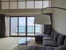 Modern living room with large windows and ocean view