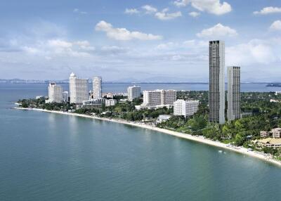 Aerial view of coastal city with high-rise buildings