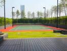 Modern outdoor tennis court surrounded by greenery