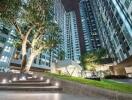 Modern high-rise apartment buildings with green landscaping