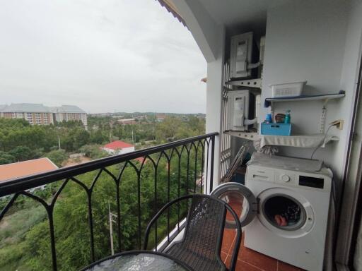 Balcony with washing machine and outdoor view