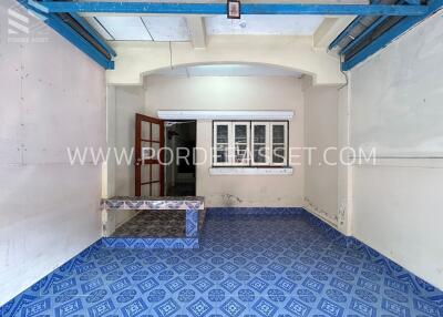 Interior space with blue patterned floor and white walls