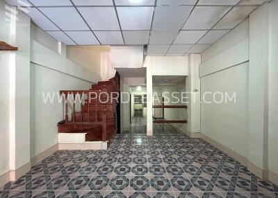 Staircase entryway with tiled floor