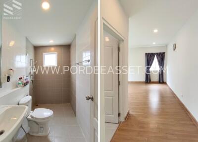 Bathroom and living area with hardwood floors