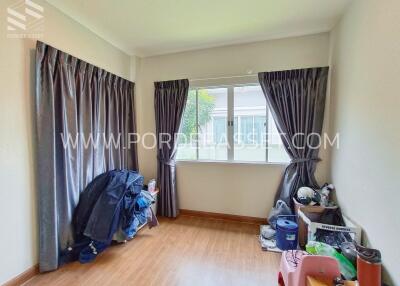 Bedroom with window and curtains