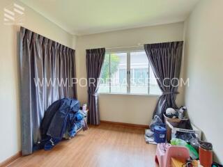 Bedroom with window and curtains