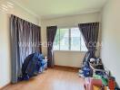 Bedroom with window and curtains