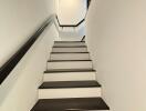 Bright modern staircase with black and white theme