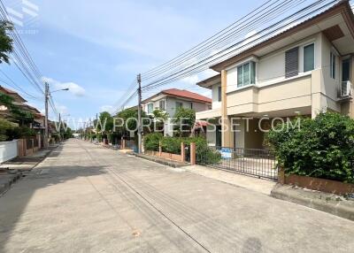 A street view of modern residential houses with clear skies