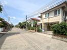 A street view of modern residential houses with clear skies