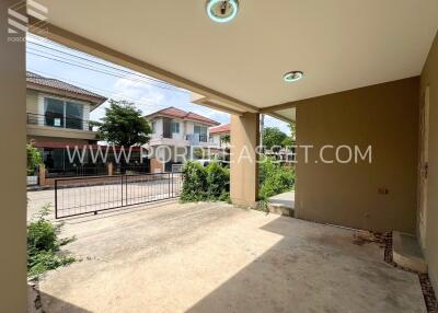 Covered outdoor area with view of neighboring houses