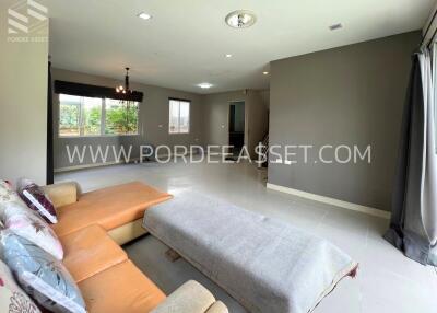 spacious living room with sofa and large window