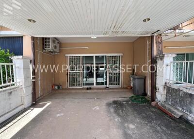 covered carport with sliding glass door