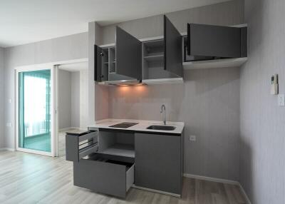 Modern kitchen with open cabinets and drawers