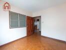 empty bedroom with wooden floor