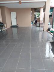 Covered outdoor area with tiled flooring