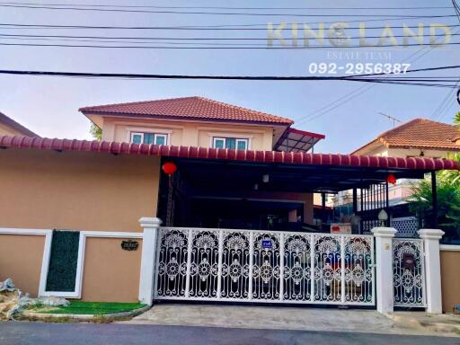 Front view of a residential house with a gate