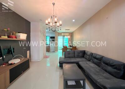 Living room with modern furnishings and chandelier