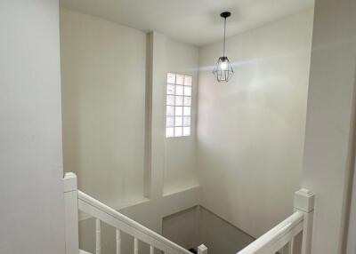 Well-lit staircase with modern lighting