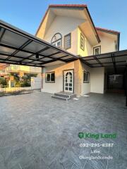 Modern two-story house with covered parking area