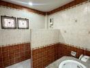 Bathroom with tiled walls and a wash basin