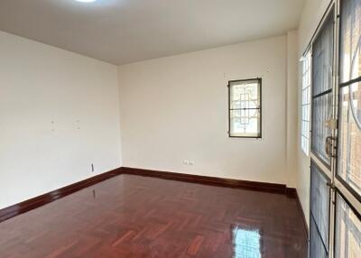 Empty living room with parquet flooring