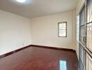 Empty living room with parquet flooring