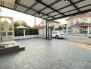 Carport with a parked car in a residential area