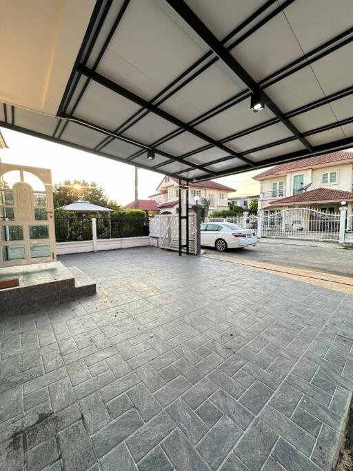 Carport with a parked car in a residential area