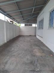 Indoor garage with concrete floor and metal roofing