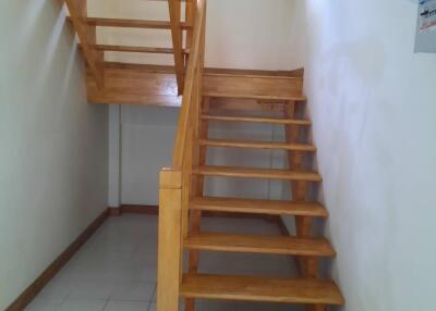 Simple wooden staircase with a landing