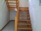 Simple wooden staircase with a landing