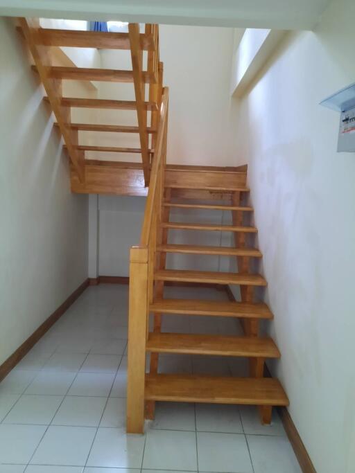 Simple wooden staircase with a landing