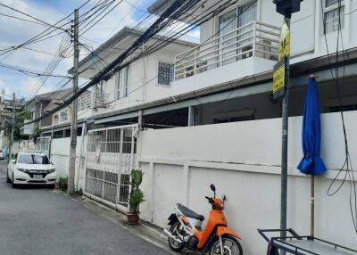 Exterior view of the property with vehicles parked outside