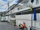 Exterior view of the property with vehicles parked outside