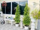 Front porch with decorative plants and ornaments