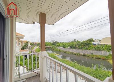 View from balcony overlooking canal and greenery