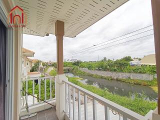 View from balcony overlooking canal and greenery