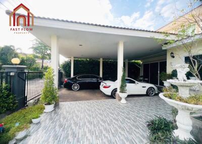 Covered garage with two cars in a residential property