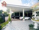 Covered garage with two cars in a residential property