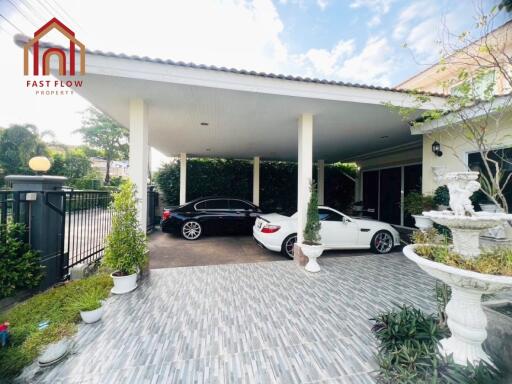 Covered garage with two cars in a residential property